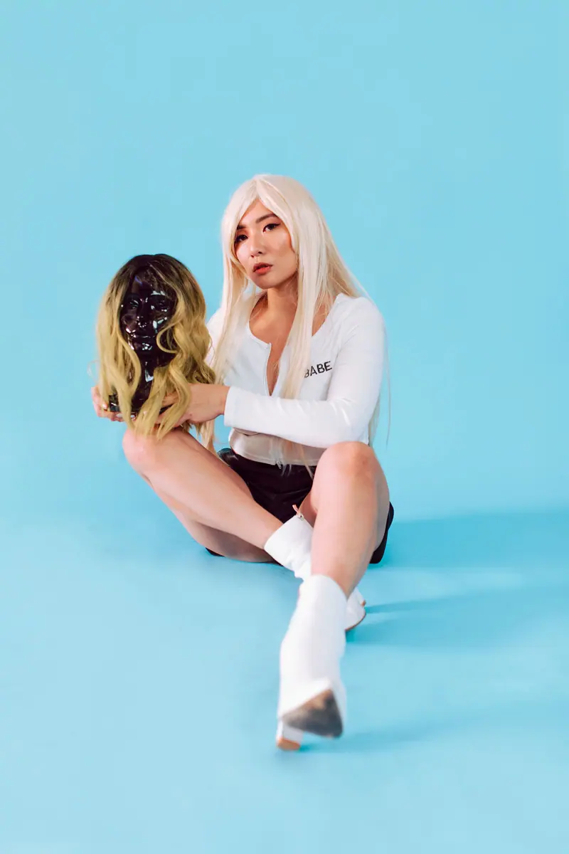 Pastel blonde wig on sky blue