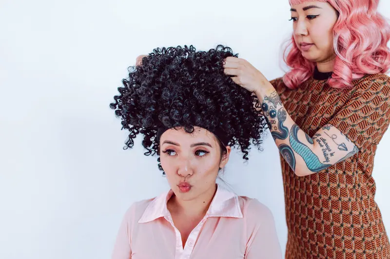 Afro wig and pink wig, playful styling