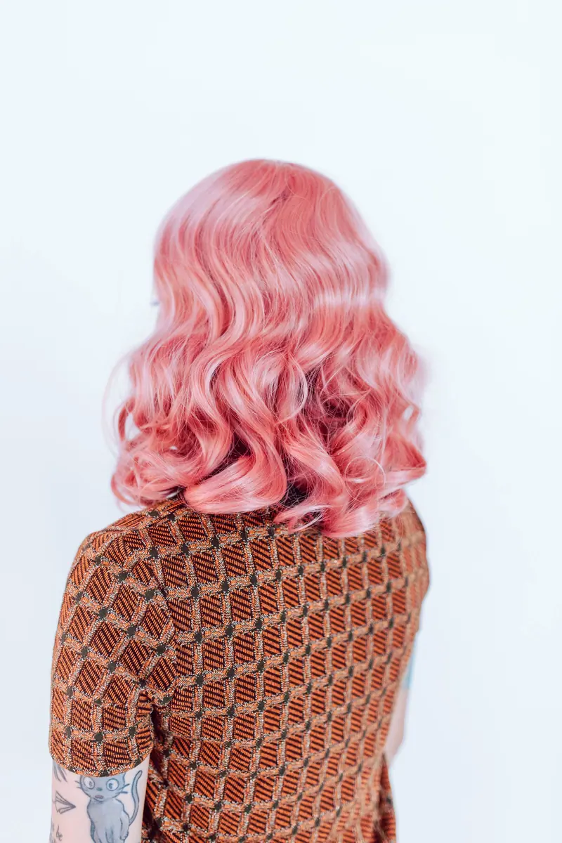 Pink wavy wig from behind