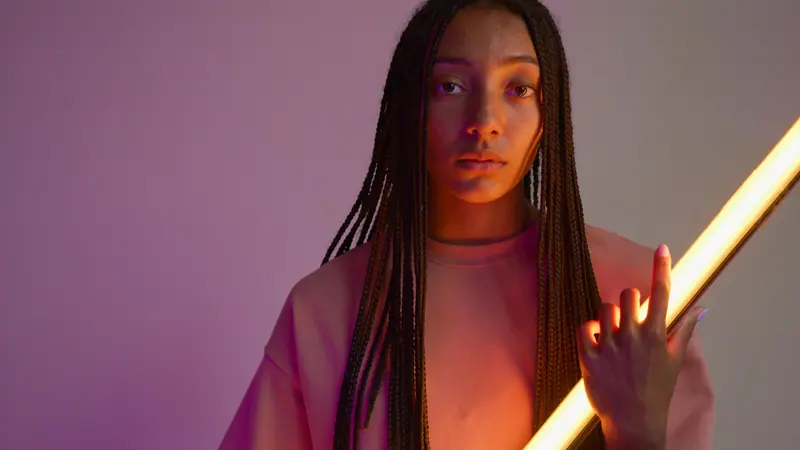 Long braids in violet light