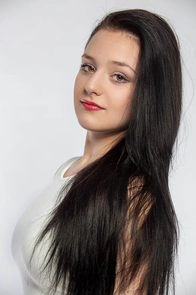 Long dark hair against white