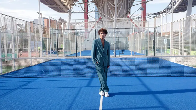 Teal suit on a cobalt court