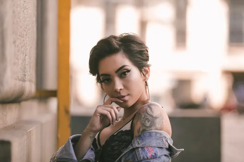 Short dark undercut and tattoos