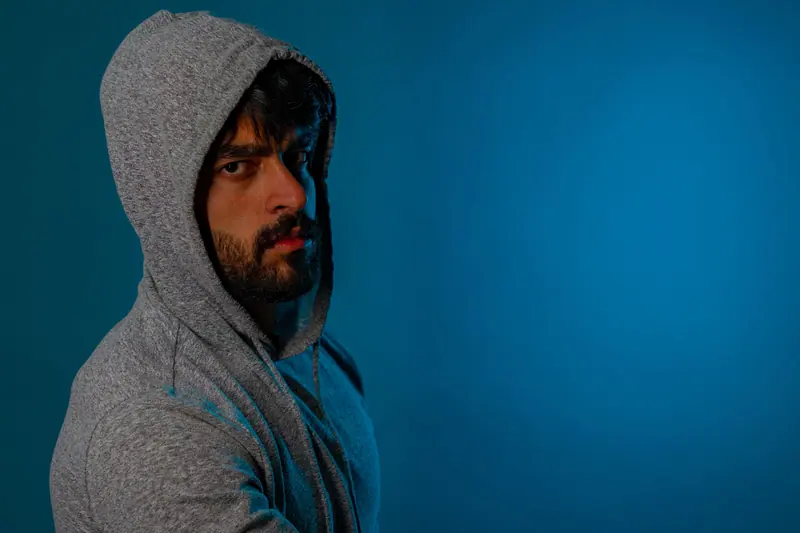 Hooded crop against teal