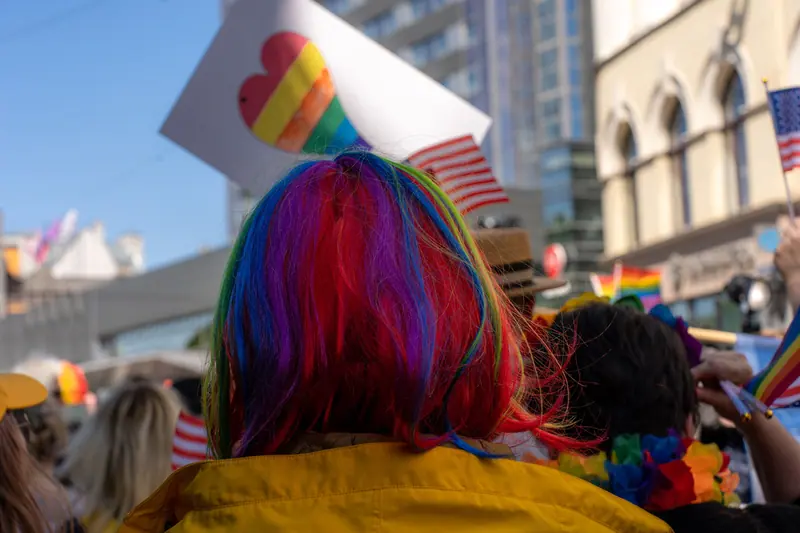 Colorful scene at a Pride parade in Riga, showcasing diversity and joy.