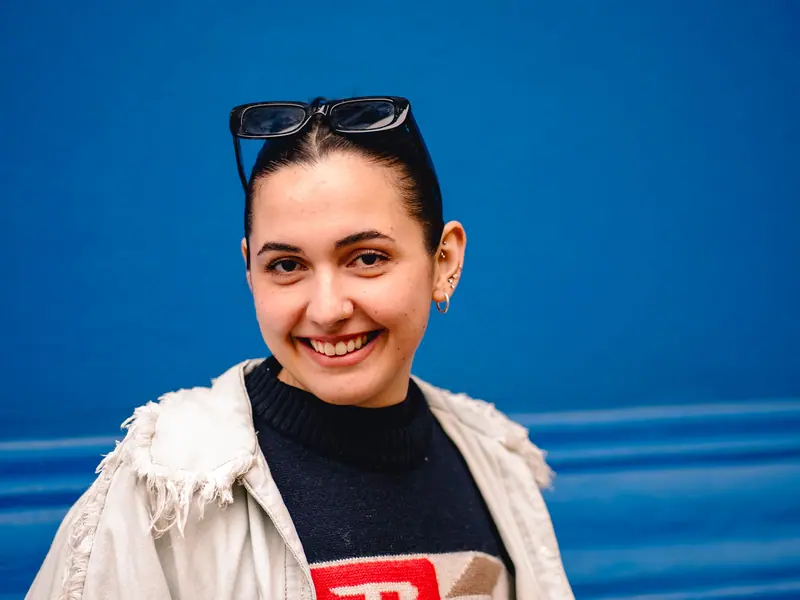 Slicked dark hair on electric blue