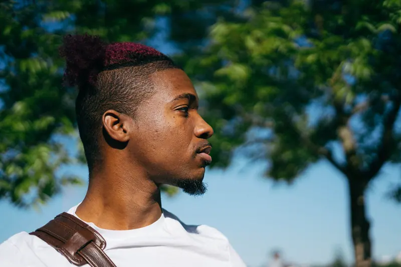 Burgundy-tipped high top with a shaved side