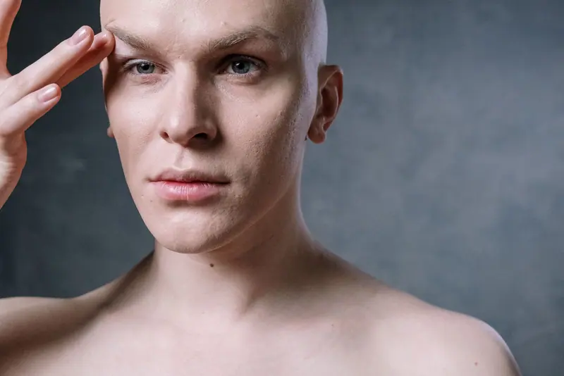 Shaved head in studio light