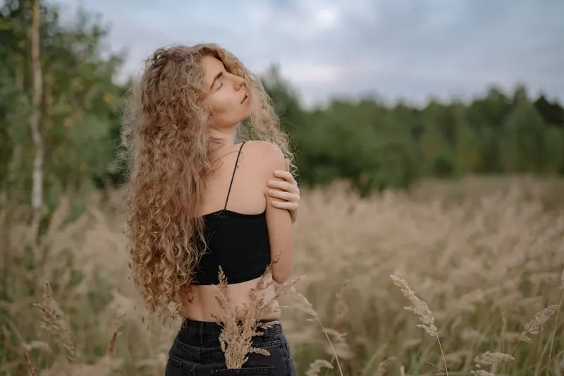 Long blonde curls in a meadow