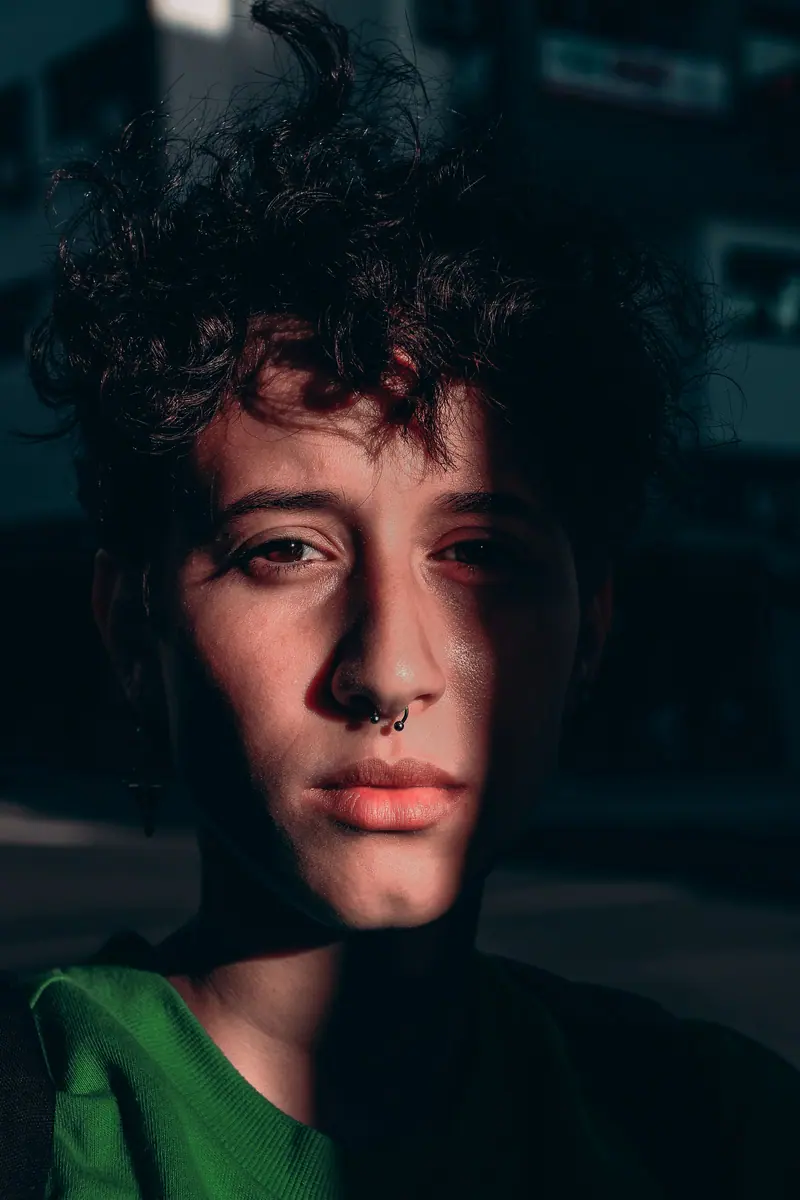 Curly hair in dramatic low light