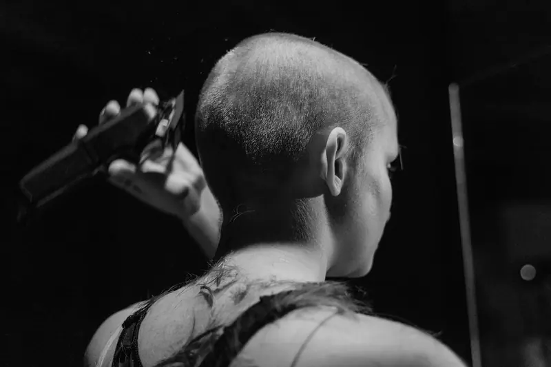 Shaved head and clippers in black and white