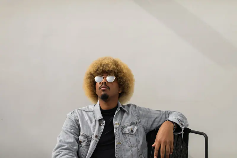 Golden afro and a denim jacket