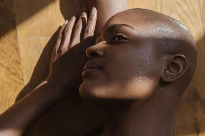 Shaved head in warm light