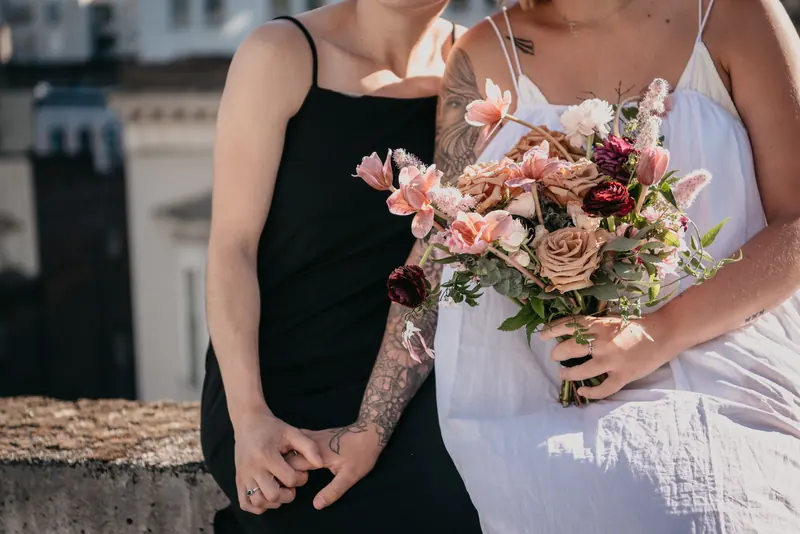 Brides' hands and a bouquet
