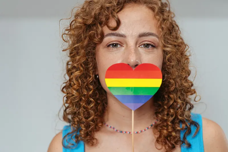 Bright curls and a rainbow heart prop