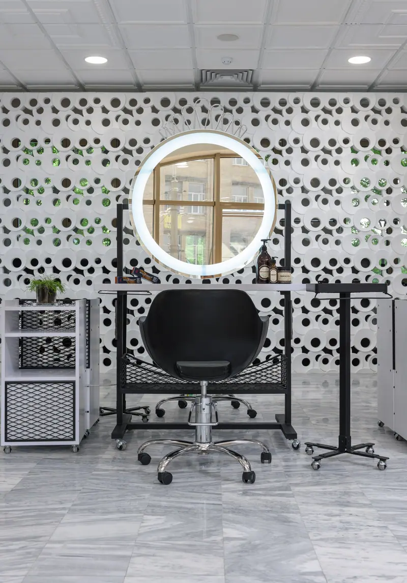 Chic salon setup featuring contemporary furniture and luxury lighting.
