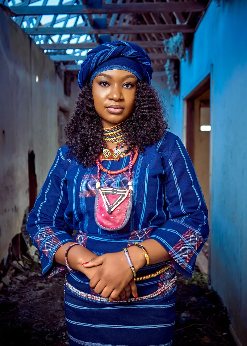 Captivating portrait of a Fulani woman in vibrant traditional dress, Minna.
