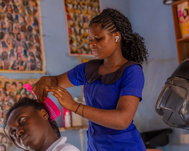 Braider at work in a vibrant salon