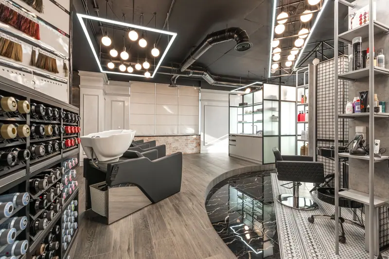 Stylish and spacious hair salon interior with contemporary design elements.