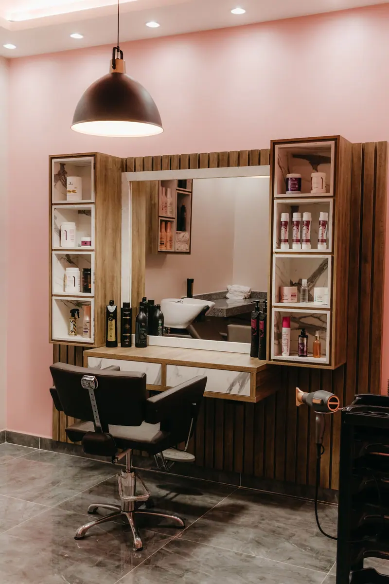 Stylish barber shop with sleek furniture and ambient lighting for a contemporary grooming experience.