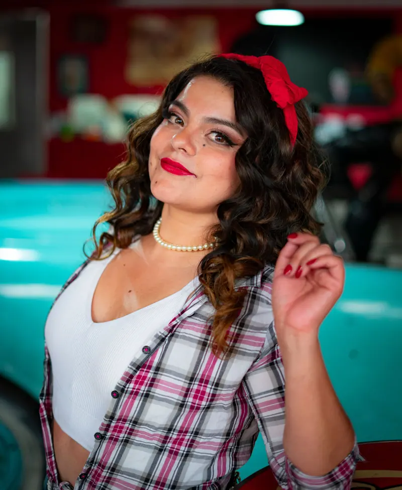 Long retro curls and a red bandana