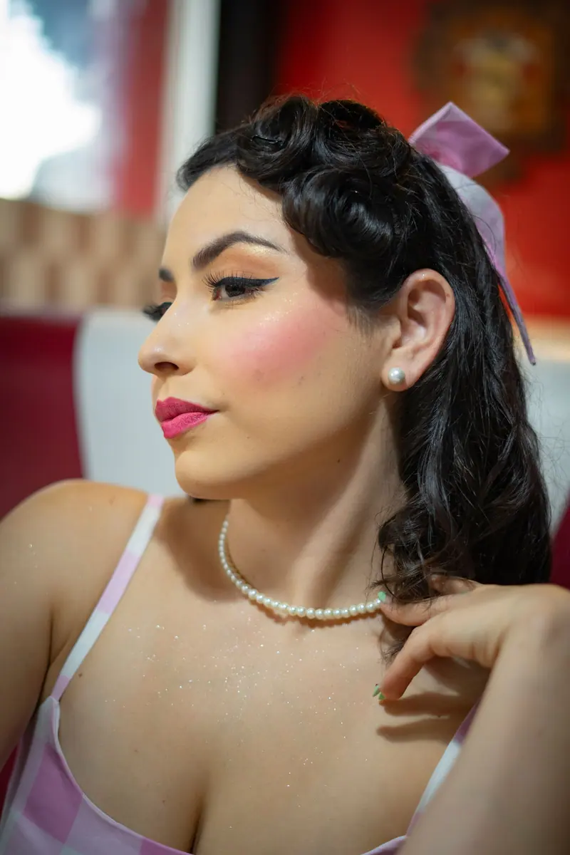 Glossy black pin curls and pearls