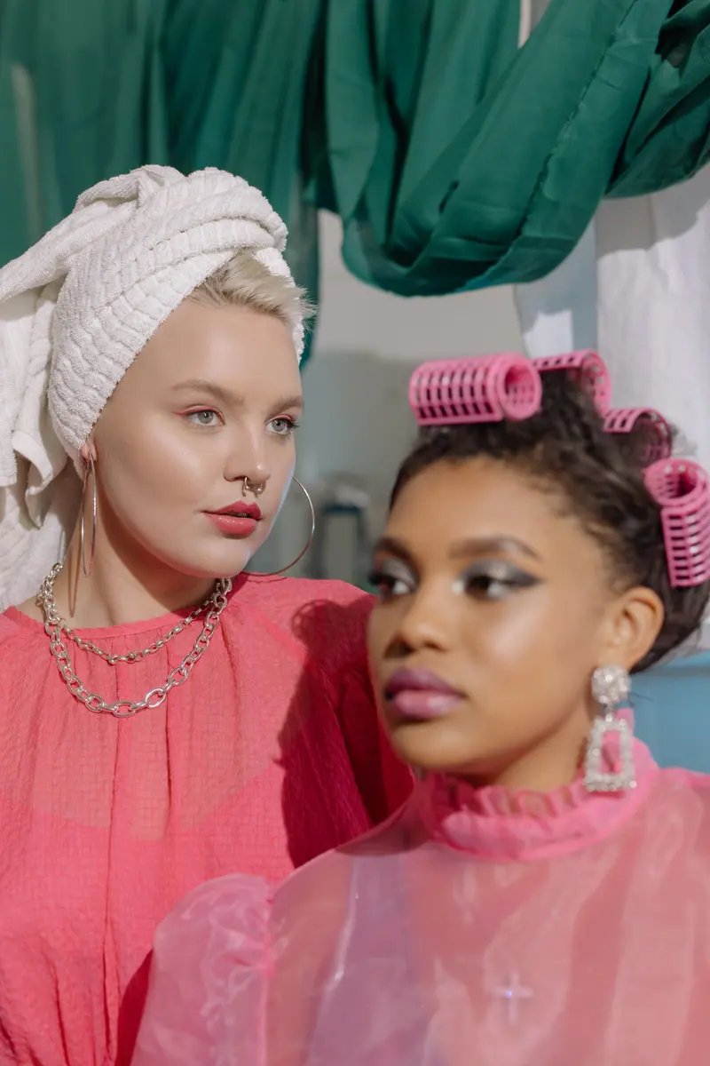 Two friends, one in pink rollers