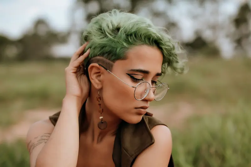 Sage curls and wire glasses in a meadow