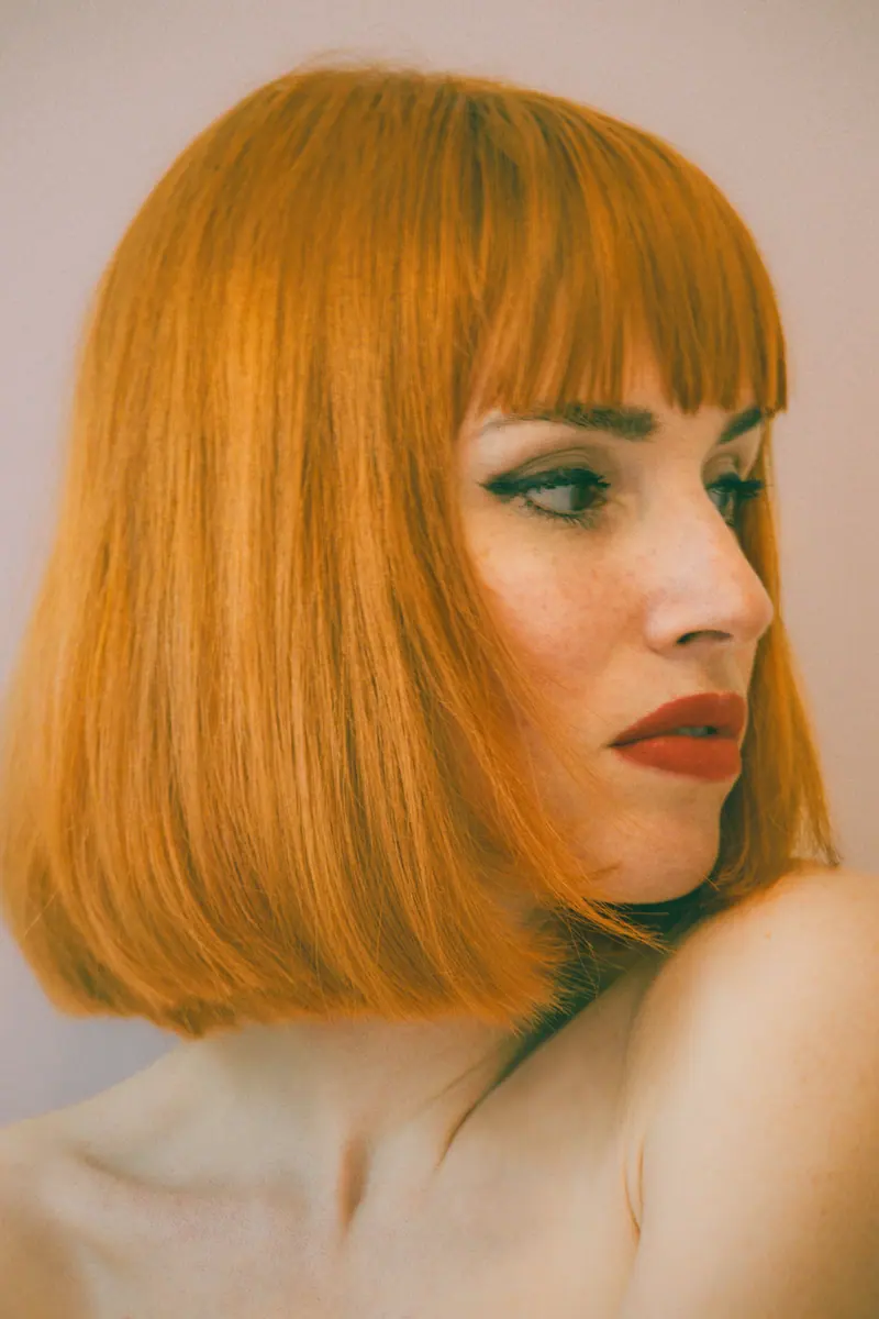 Blunt marigold bob with a heavy fringe
