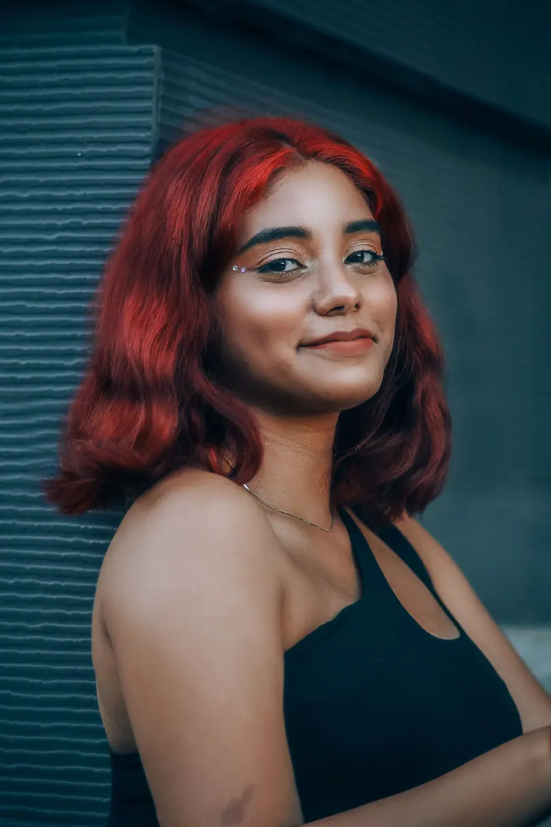 Smiling client with bright red hair