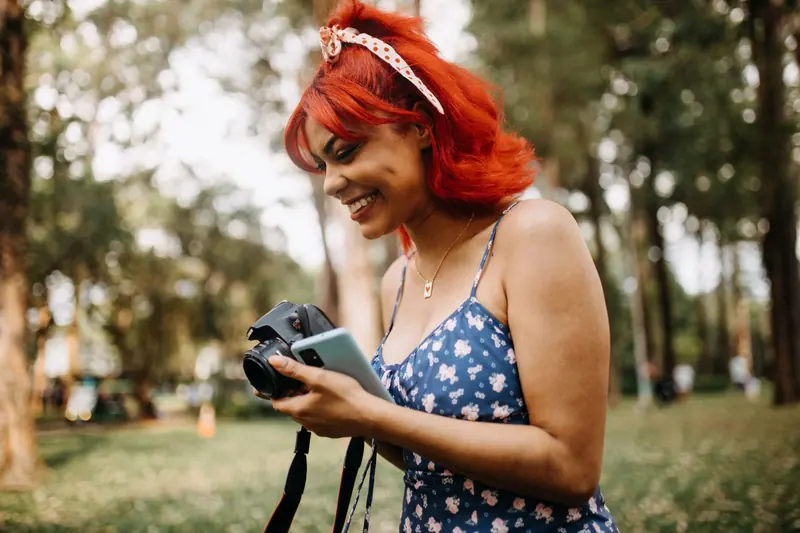 Red-copper hair in a sunny park