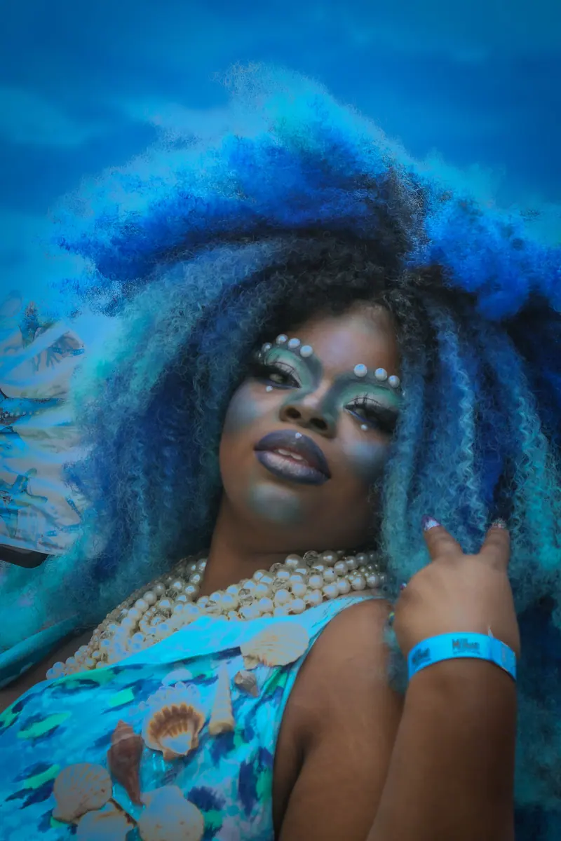 Voluminous cobalt-blue curls with pearl accents