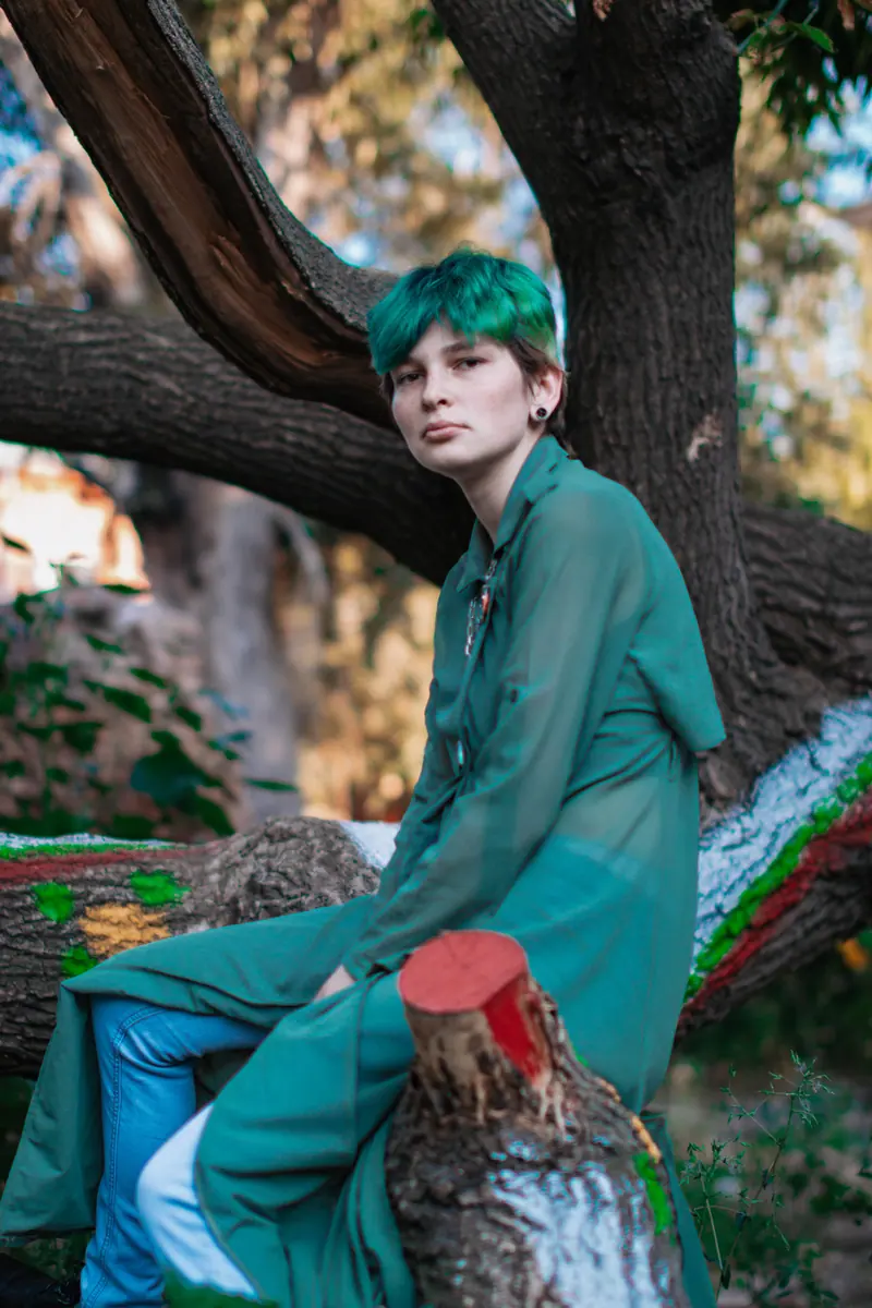 Green crop and a teal suit in a tree