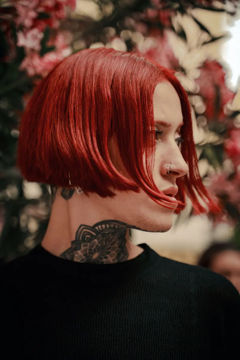 Red hair with floral tattoos