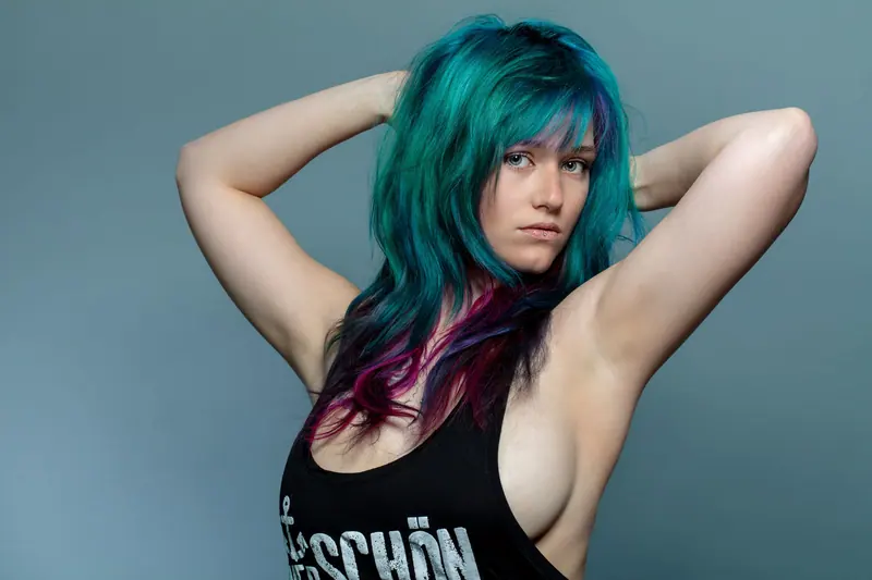 Teal and plum waves, arms raised