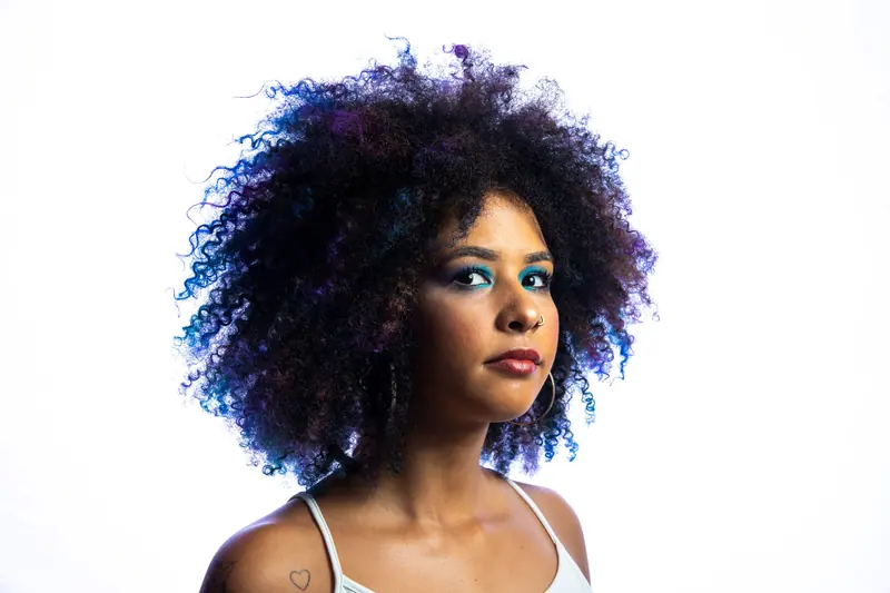 Indigo curls and teal eye makeup