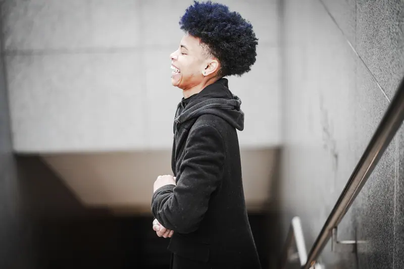 Indigo afro and a big smile