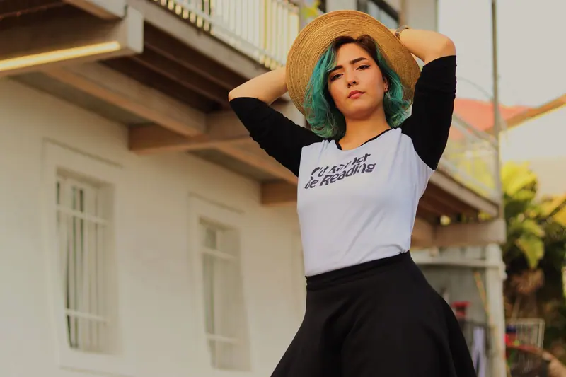 Teal hair under a summer hat