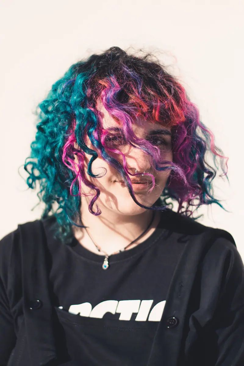 Short curls in hot pink, violet and teal