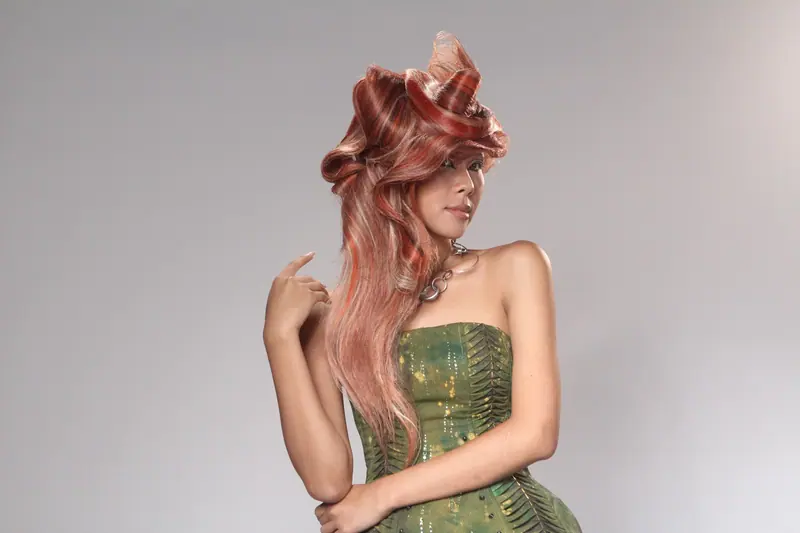 Sculpted rose-gold hair against white