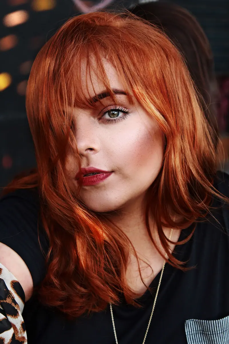 Close-up of a confident redhead