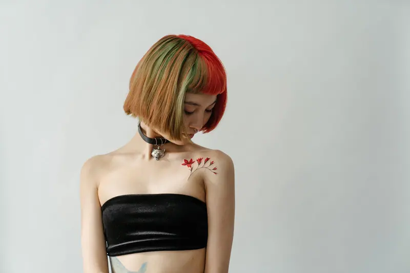 Two-tone red and honey bob, eyes lowered