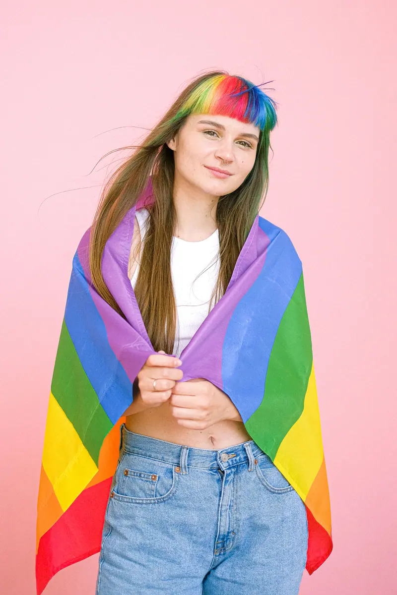 Rainbow fringe and a pride flag on pink