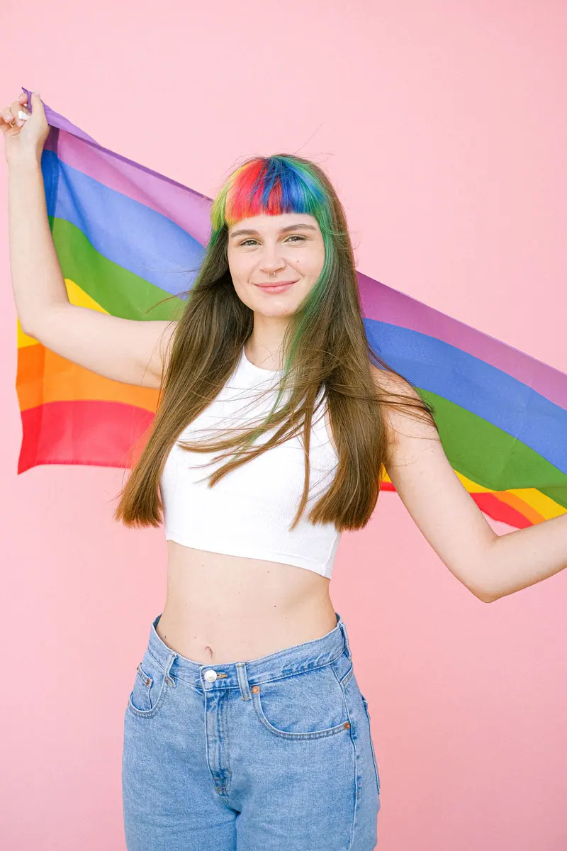 Rainbow hair and a pride flag