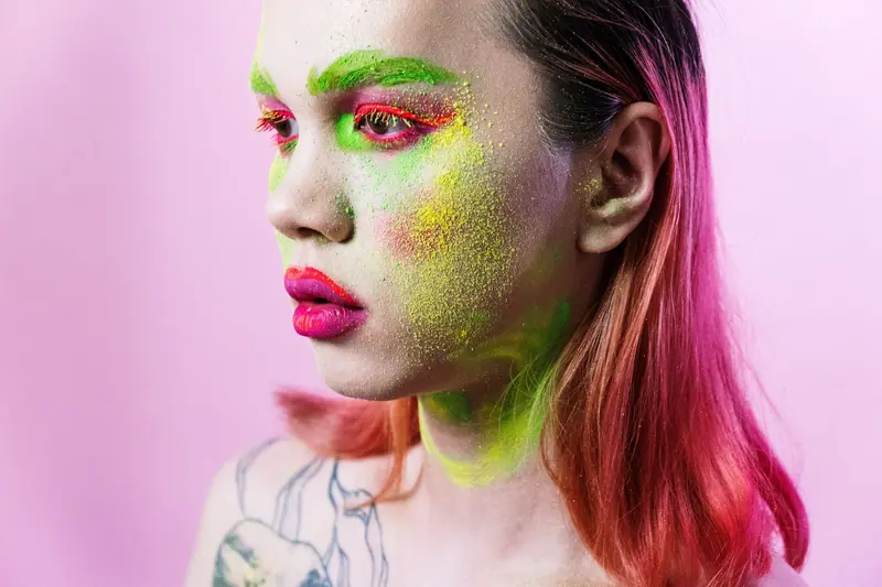 Pink hair and neon green makeup
