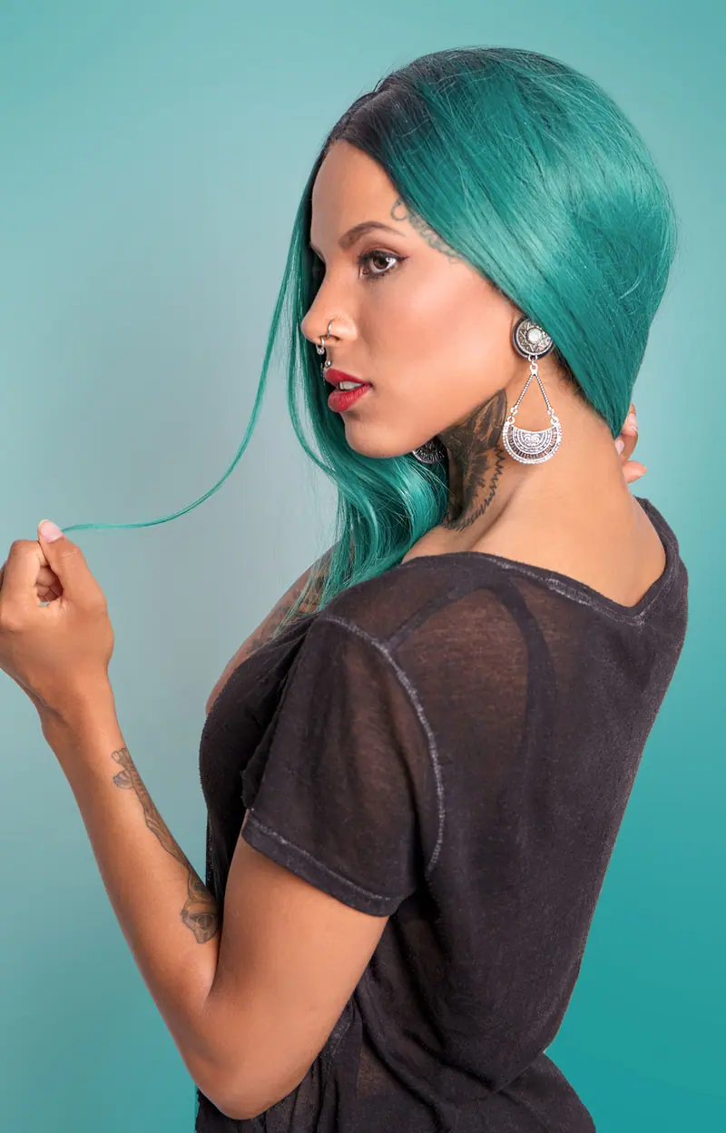 Teal hair in profile on seafoam