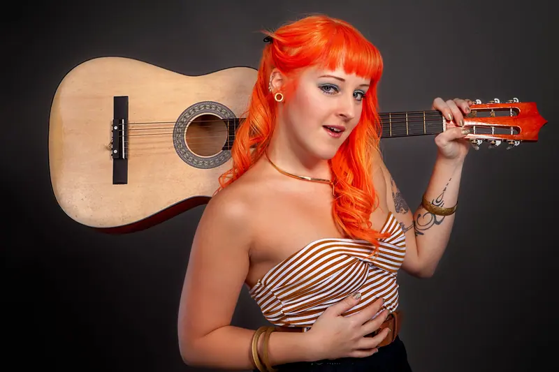 Orange hair and a guitar