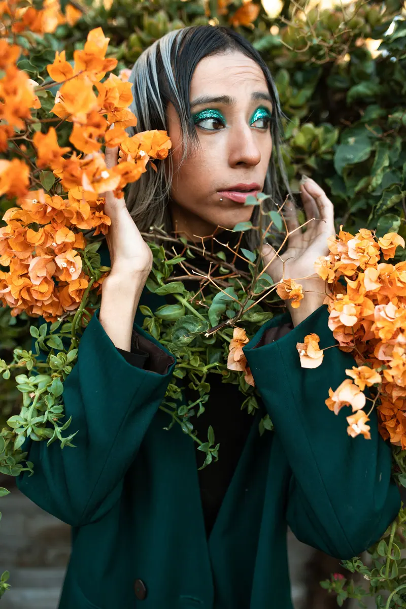 Teal makeup and orange blossoms
