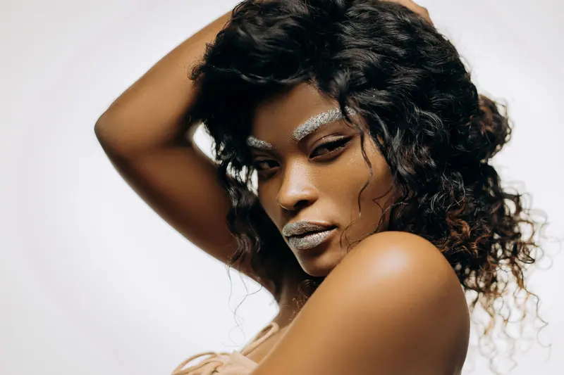 Curls and silver brow gems