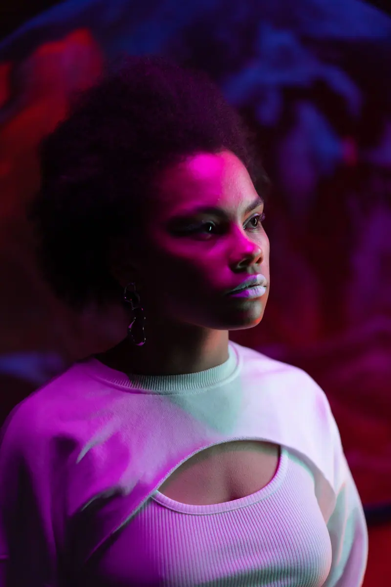 Natural curls under magenta light